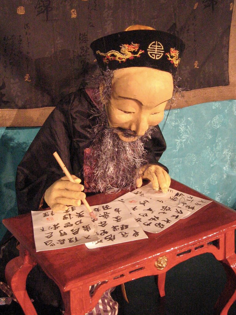 Lisa Sturz - Loshi writing Chinese characters in the puppet show The Big Dipper